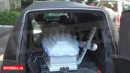 Ion Dichiseanu poartă un costum complet alb, în sicriu