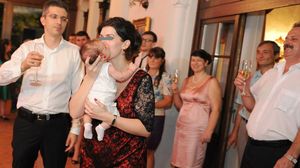 Dan si Uliana Condrea la botezul micutului David. Primul din dreapta, cu mustata, este Arcadie Ochinciuc