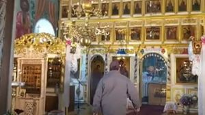 barbat inarmat in biserica tulcea