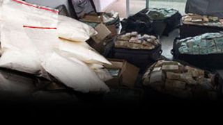 VIDEO - „Escobar de România”, valize pline cu bani în casă