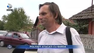 Politiști atacați cu barda