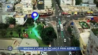 Mașinile care se încarcă prin asfalt