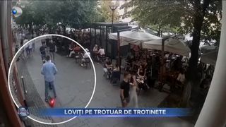 Loviți pe trotuar de trotinete