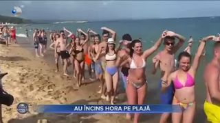 Au &icirc;ncins hora pe plajă