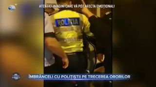 &Icirc;mbr&acirc;nceli cu polițiștii pe trecerea ororilor