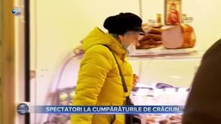 Spectatori la cumpărăturile de Crăciun