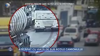 A scăpat cu viață de sub roțile camionului