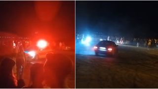 VIDEO- Mașină de poliție din Dolj, &icirc;nconjurată de sute de tineri care au participat la un concurs de drifturi și liniuțe
