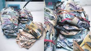 Un român a dus trei teancuri de bani topiţi la Banca Naţională şi a primit bancnote noi