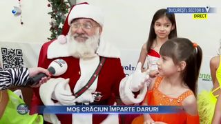 VIDEO - Moș Crăciun împarte daruri. Micuții din Sectorul 6 al Capitalei au fost emoționați la întâlnirea cu Moșul