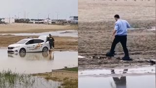 VIDEO. „Și-au băgat picioarele în saci de gunoi”. Imagini amuzante cu doi polițiști din Constanța care au rămas cu mașina blocată în baltă, pe plajă. Cum au decis să iasă din încurcătură