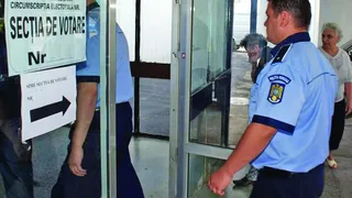 A intrat cu arma de foc în secția de vot