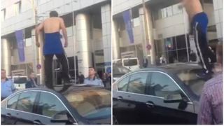 Scandal in Capitala, ziua in amiaza mare! Un barbat a fost filmat cand sare pe plafonul unei masini