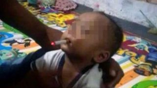 Un tata si-a obligat bebelusul de 9 luni sa fumeze, iar imaginea a ajuns pe internet! Ce s-a intamplat cand a intervenit Politia