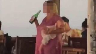 Imagini revoltatoare cu o mama care bea alcool in timp ce bebelusul plange pana la lesin