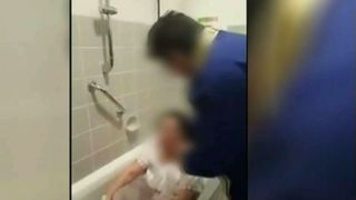 Botez inedit! O femeie a fost crestinata chiar in propria baie