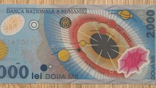 Cât se oferă acum pe bancnota de 2.000 de lei cu eclipsa din 1999. Unele exemplare ajung la sume colosale